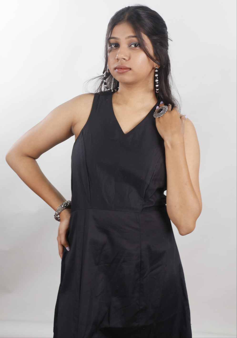 Black sleeveless gown with beaded slit