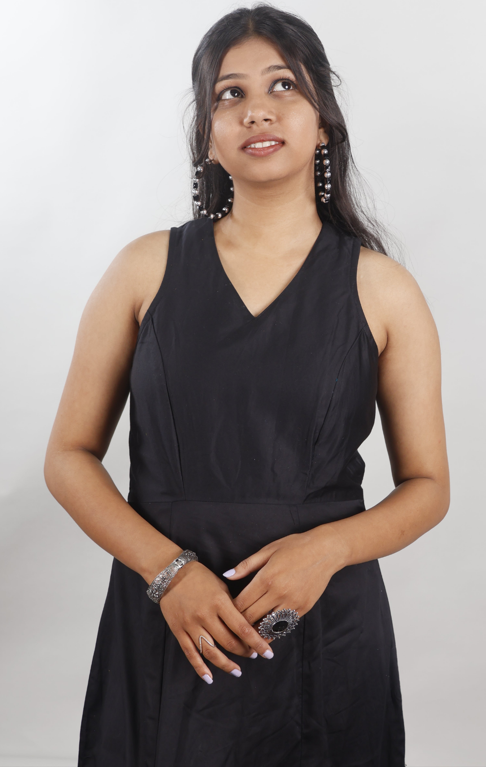 Black sleeveless gown with beaded slit