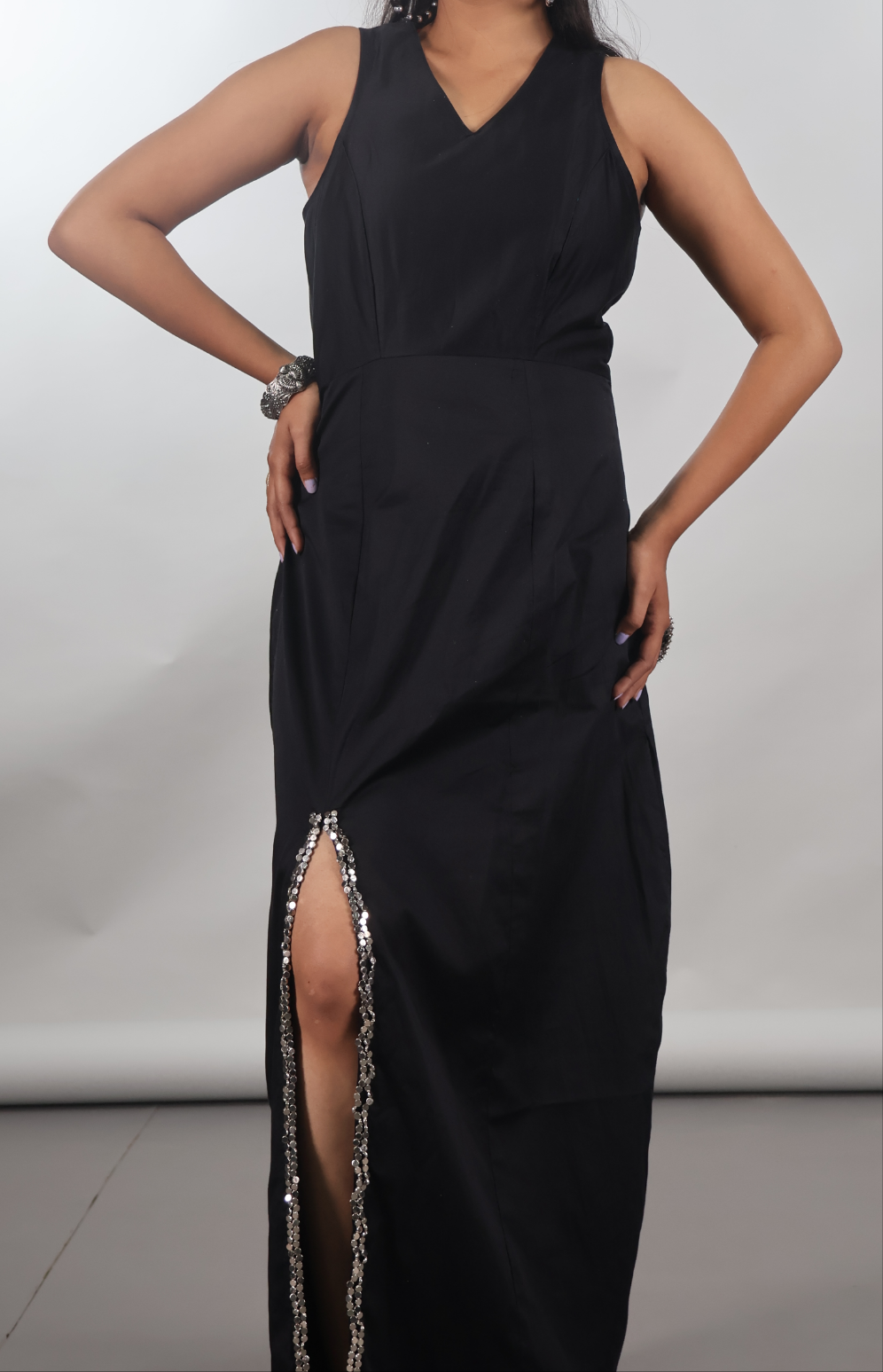Black sleeveless gown with beaded slit
