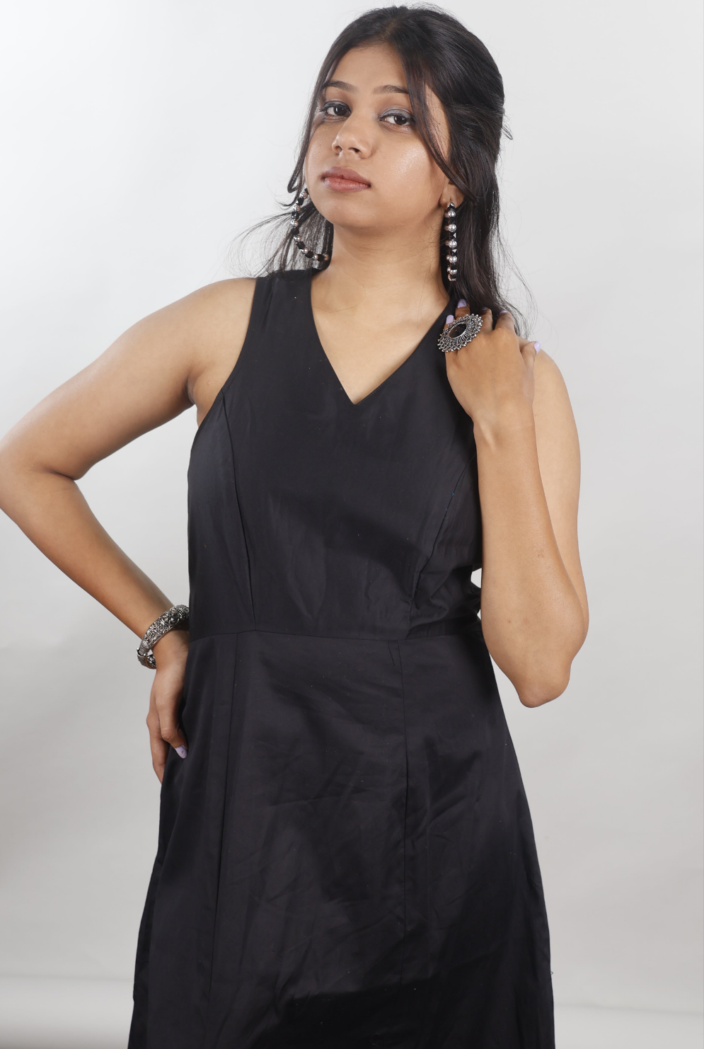 Black sleeveless gown with beaded slit